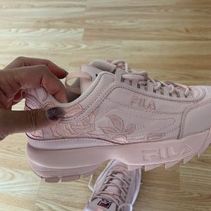 Pink Fila Disruptors with embroidered design